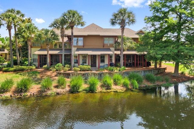 8585 Magnolia Bay Ln, Miramar Beach, FL 32550 - rear view of house featuring a water view and a shingled roof