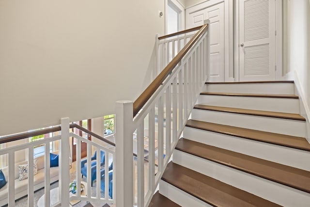 8585 Magnolia Bay Ln, Miramar Beach, FL 32550 - staircase featuring a high ceiling