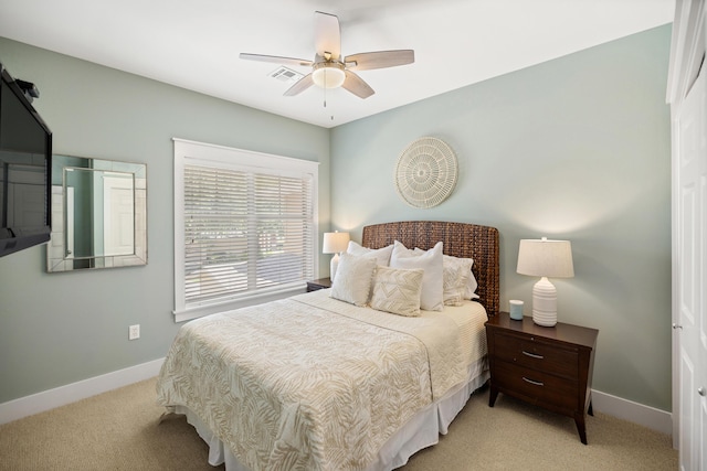 8585 Magnolia Bay Ln, Miramar Beach, FL 32550 - bedroom with light carpet, baseboards, and a ceiling fan