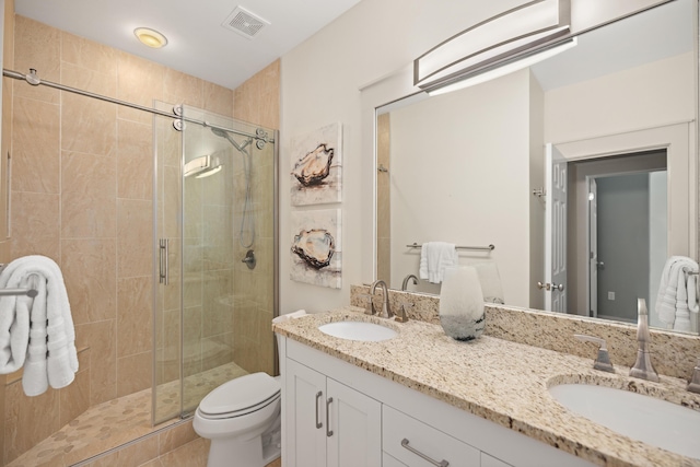 8585 Magnolia Bay Ln, Miramar Beach, FL 32550 - bathroom featuring double vanity, a stall shower, and toilet