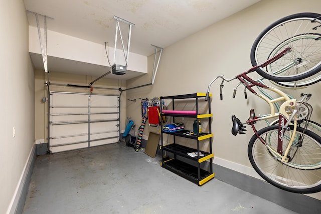 8585 Magnolia Bay Ln, Miramar Beach, FL 32550 - garage with baseboards and a garage door opener