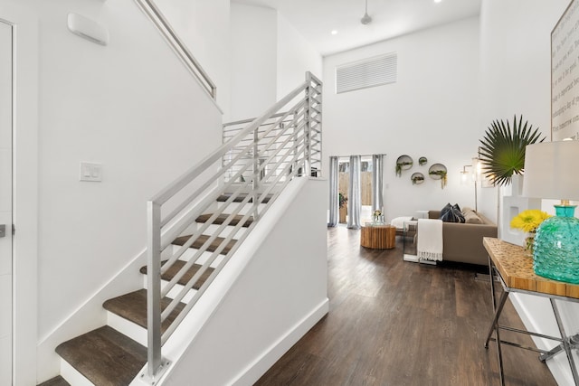 130 Durango Rd Unit 104, Destin, FL 32541 - stairs with a high ceiling, wood finished floors, and recessed lighting