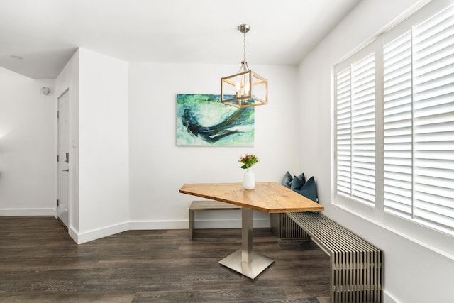 130 Durango Rd Unit 104, Destin, FL 32541 - dining area with wood finished floors, a chandelier, baseboards, and breakfast area