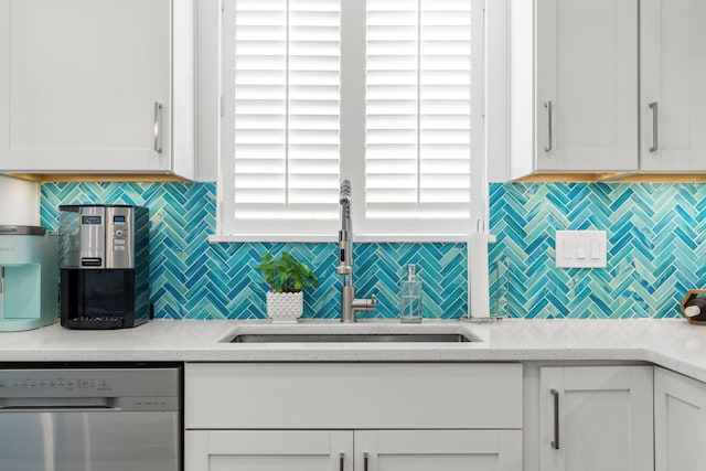 130 Durango Rd Unit 104, Destin, FL 32541 - kitchen featuring dishwasher, a sink, white cabinets, and backsplash