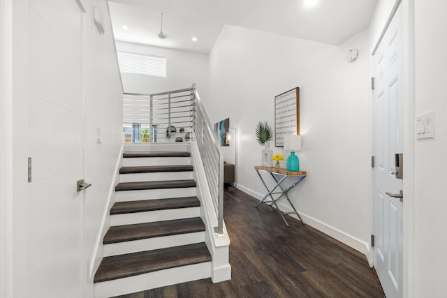 130 Durango Rd Unit 104, Destin, FL 32541 - staircase with baseboards, wood finished floors, recessed lighting, and a towering ceiling