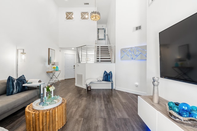 130 Durango Rd Unit 104, Destin, FL 32541 - living area with a towering ceiling, baseboards, wood finished floors, and stairway