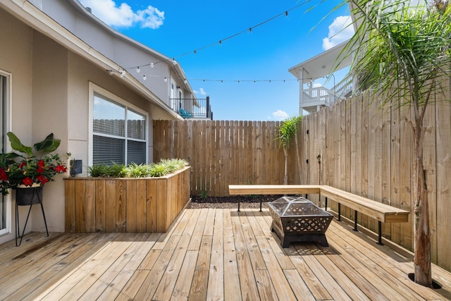 130 Durango Rd Unit 104, Destin, FL 32541 - deck featuring a fire pit