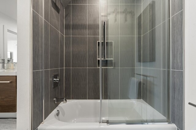 130 Durango Rd Unit 104, Destin, FL 32541 - full bath featuring shower / bath combination with glass door and vanity