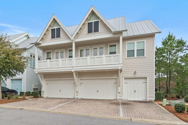 58 E Milestone Dr Unit B, Inlet Beach, FL 32461 - townhome / multi-family property with a garage, driveway, and a balcony