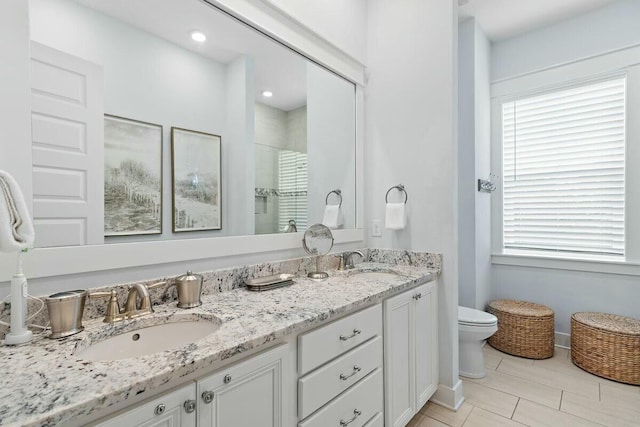 58 E Milestone Dr Unit B, Inlet Beach, FL 32461 - bathroom featuring toilet, double vanity, a shower, and baseboards