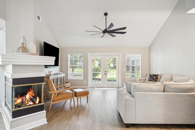 865 Indigo Loop, Destin, FL 32550 - living area featuring vaulted ceiling, ceiling fan, wood finished floors, a fireplace, and french doors