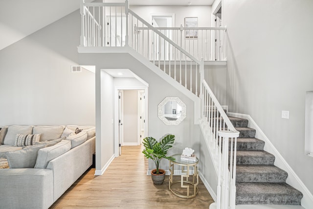 865 Indigo Loop, Destin, FL 32550 - stairs with wood finished floors, baseboards, a towering ceiling, and recessed lighting