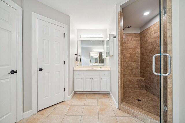 865 Indigo Loop, Destin, FL 32550 - bathroom with tile patterned floors, vanity, a stall shower, and baseboards