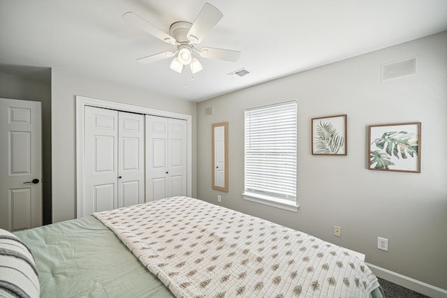 865 Indigo Loop, Destin, FL 32550 - bedroom with baseboards, a closet, carpet flooring, and a ceiling fan