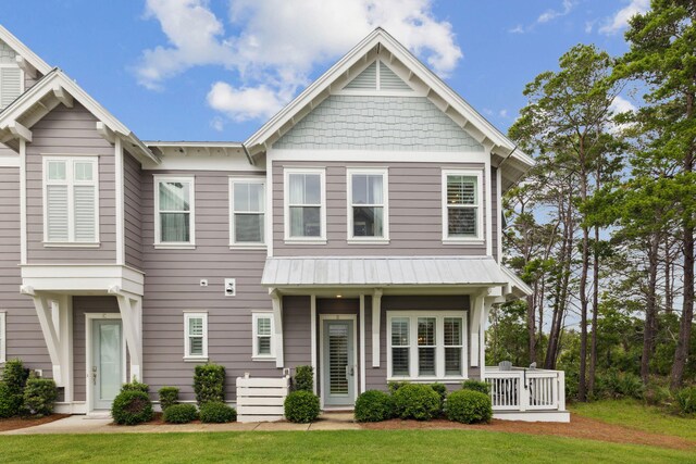 25 E Pine Lands Loop Unit B, Inlet Beach, FL 32461 - view of front of home featuring a front lawn, metal roof, and a standing seam roof