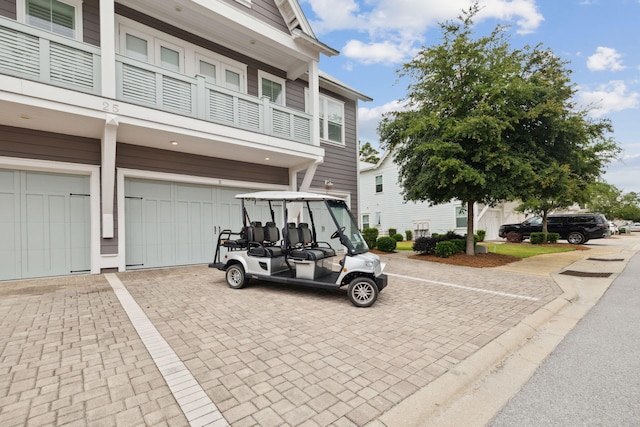 25 E Pine Lands Loop Unit B, Inlet Beach, FL 32461 - view of front of property with a garage, a balcony, and decorative driveway