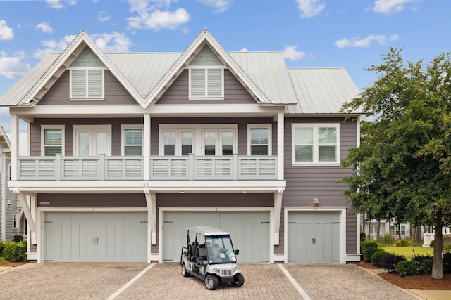 25 E Pine Lands Loop Unit B, Inlet Beach, FL 32461 - view of property featuring an attached garage, a balcony, and driveway