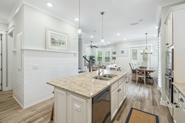 25 E Pine Lands Loop Unit B, Inlet Beach, FL 32461 - kitchen featuring stainless steel appliances, a sink, light wood-style flooring, crown molding, and light stone counters