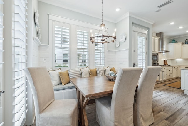 25 E Pine Lands Loop Unit B, Inlet Beach, FL 32461 - dining space featuring a chandelier, breakfast area, crown molding, wood finished floors, and recessed lighting
