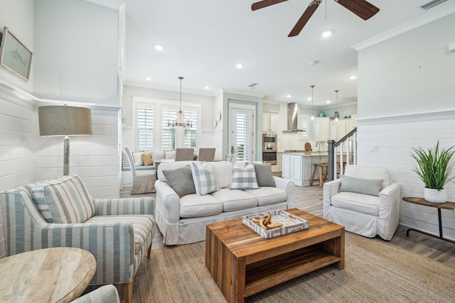 25 E Pine Lands Loop Unit B, Inlet Beach, FL 32461 - living room with a ceiling fan, crown molding, recessed lighting, light wood-style floors, and a chandelier