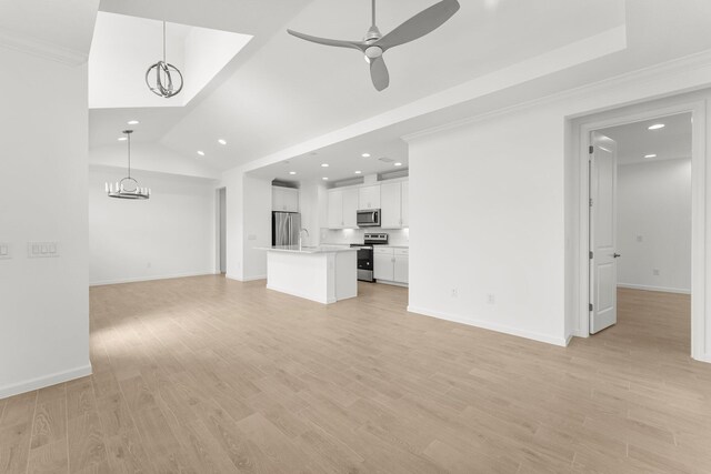 8454 Dreams Float Ct, Panama City Beach, FL 32413 - unfurnished living room with recessed lighting, a ceiling fan, ornamental molding, light wood finished floors, and vaulted ceiling