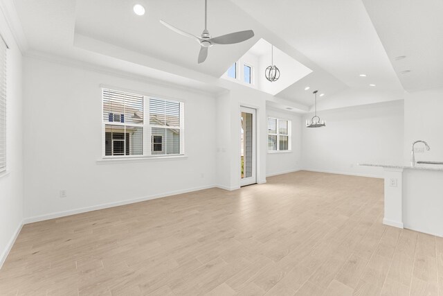 8454 Dreams Float Ct, Panama City Beach, FL 32413 - unfurnished living room featuring vaulted ceiling, a sink, recessed lighting, a ceiling fan, and baseboards