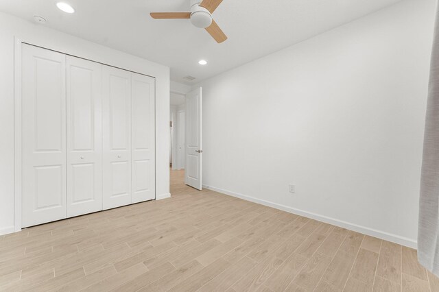 8454 Dreams Float Ct, Panama City Beach, FL 32413 - unfurnished bedroom with light wood-style flooring, baseboards, a closet, recessed lighting, and ceiling fan