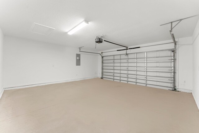 8454 Dreams Float Ct, Panama City Beach, FL 32413 - garage with a garage door opener, electric panel, and baseboards