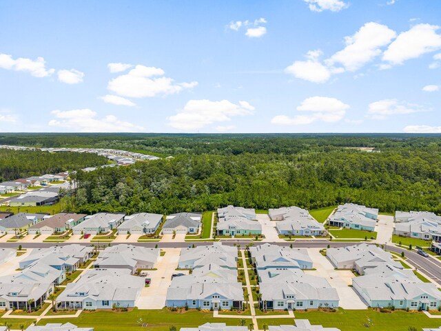8454 Dreams Float Ct, Panama City Beach, FL 32413 - aerial perspective of suburban area with a forest