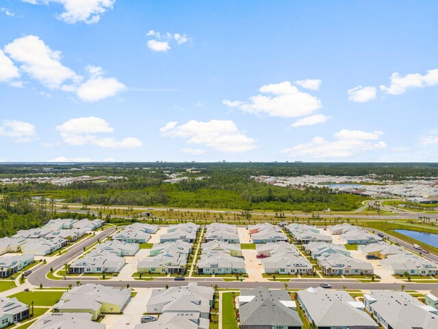 8454 Dreams Float Ct, Panama City Beach, FL 32413 - aerial perspective of suburban area with a large body of water