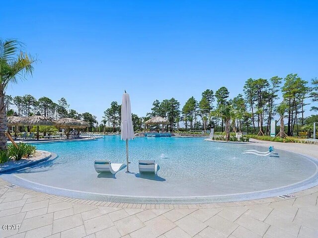 8454 Dreams Float Ct, Panama City Beach, FL 32413 - community pool featuring a gazebo