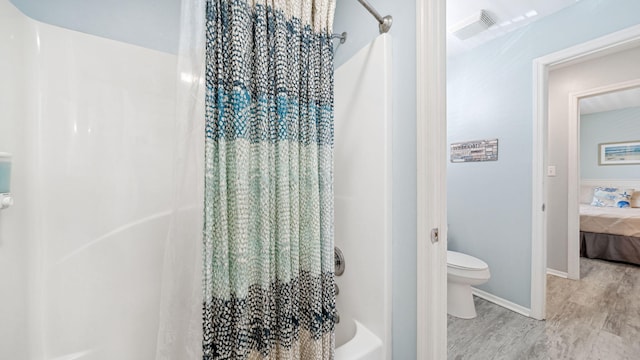 11 Beachside Dr Unit 722, Santa Rosa Beach, FL 32459 - bathroom with wood finished floors, shower / bath combo with shower curtain, and ensuite bath