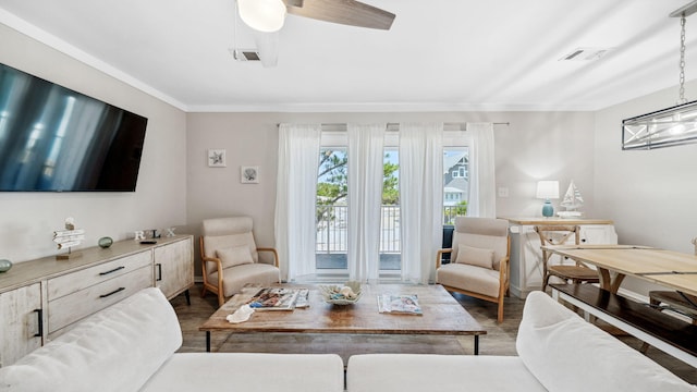 11 Beachside Dr Unit 722, Santa Rosa Beach, FL 32459 - living room with wood finished floors, a ceiling fan, and ornamental molding