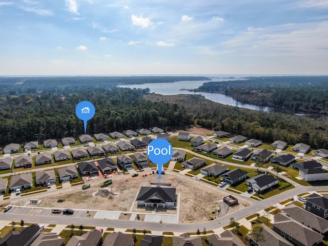 720 Riverwalk Cir, Freeport, FL 32439 - aerial view of residential area with a large body of water and a heavily wooded area