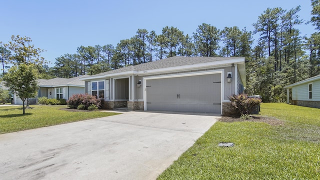 720 Riverwalk Cir, Freeport, FL 32439 - view of front of property featuring an attached garage, stone siding, driveway, a front yard, and a shingled roof