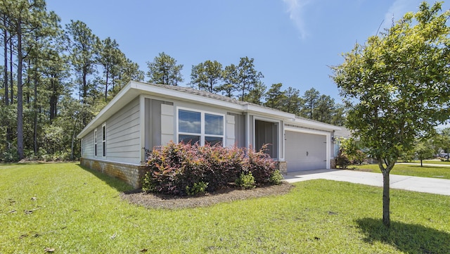 720 Riverwalk Cir, Freeport, FL 32439 - view of front of house featuring driveway, an attached garage, and a front yard