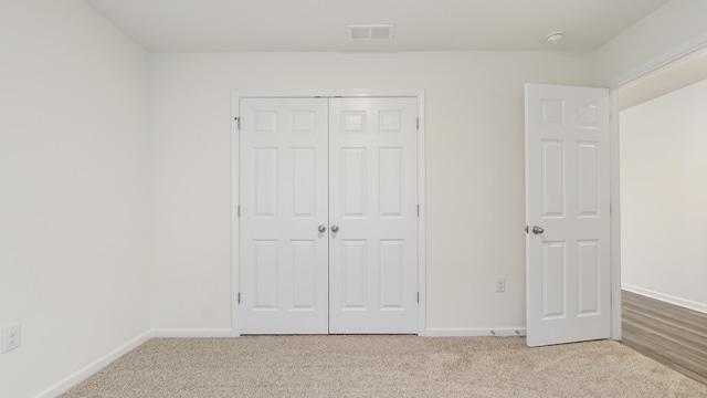 720 Riverwalk Cir, Freeport, FL 32439 - unfurnished bedroom featuring carpet floors, baseboards, and a closet