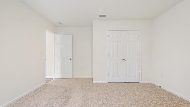 720 Riverwalk Cir, Freeport, FL 32439 - unfurnished bedroom with carpet flooring, baseboards, and a closet