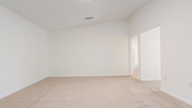 720 Riverwalk Cir, Freeport, FL 32439 - spare room with light colored carpet, baseboards, and lofted ceiling