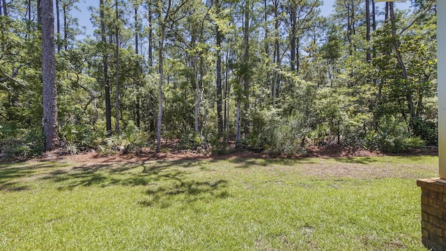 720 Riverwalk Cir, Freeport, FL 32439 - view of green lawn featuring a view of trees