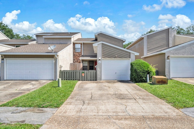 1021 4th Ave, Shalimar, FL 32579 - mid-century home with driveway, a garage, and roof with shingles
