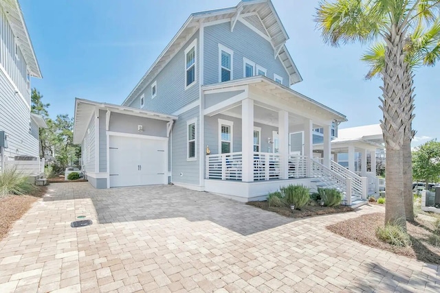 116 Gulfview Way, Santa Rosa Beach, FL 32459 - view of front of house with a porch, decorative driveway, and a garage