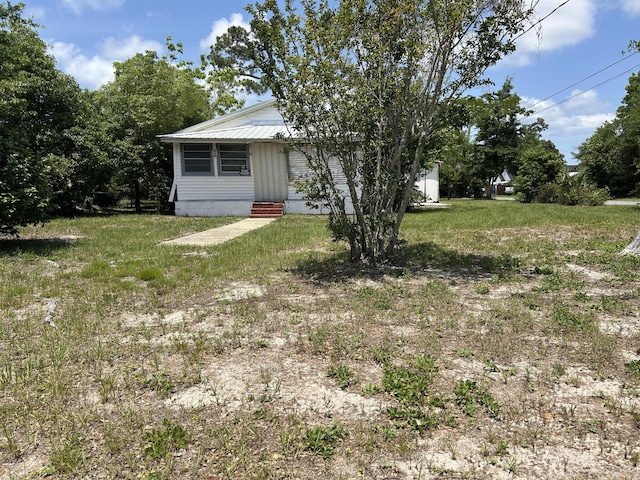 2600 W 18th St, Panama City, FL 32405 - view of grassy yard with entry steps