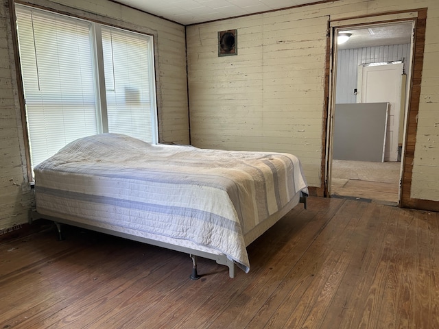 2600 W 18th St, Panama City, FL 32405 - bedroom with hardwood / wood-style floors and wood walls