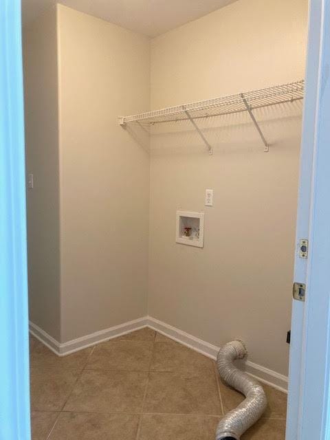 6735 Tidewater Dr, Navarre, FL 32566 - laundry room featuring baseboards, washer hookup, and light tile patterned floors