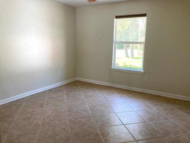 6735 Tidewater Dr, Navarre, FL 32566 - unfurnished room featuring tile patterned floors and baseboards
