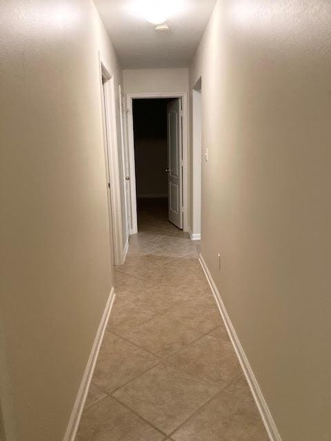 6735 Tidewater Dr, Navarre, FL 32566 - hallway with baseboards