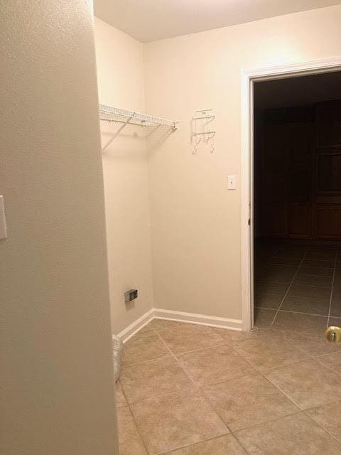 6735 Tidewater Dr, Navarre, FL 32566 - washroom featuring light tile patterned flooring and baseboards