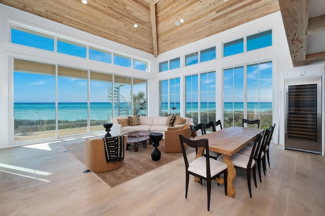 40 Jasmine Cir, Santa Rosa Beach, FL 32459 - sunroom featuring beverage cooler, a high ceiling, healthy amount of natural light, wood finished floors, and wooden ceiling