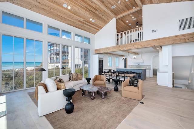 40 Jasmine Cir, Santa Rosa Beach, FL 32459 - living room with wooden ceiling, high vaulted ceiling, light wood finished floors, arched walkways, and recessed lighting